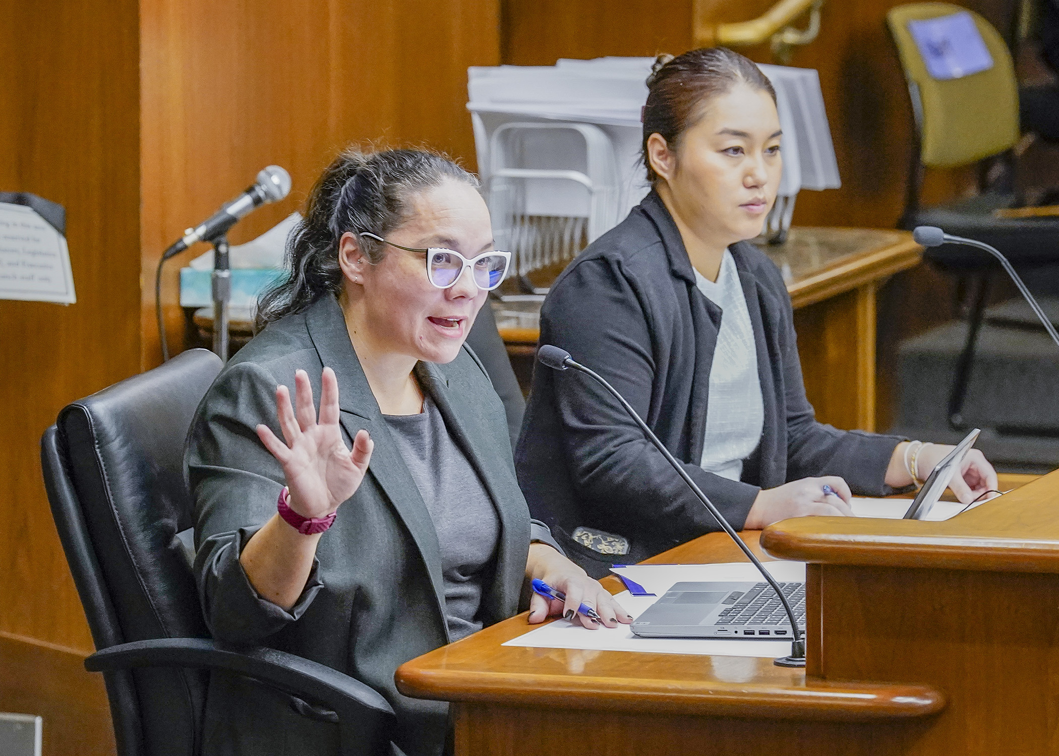 Human Rights Commissioner Rebecca Lucero testifies before the House's public safety committee Jan. 17 in support of a bill sponsored by Rep. Samantha Vang, right, to expand the reporting of crimes motivated by bias. (Photo by Andrew VonBank)